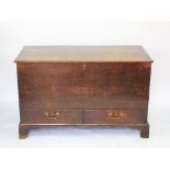 A George III oak mule chest, with hinged top above two drawers, on bracket feet,