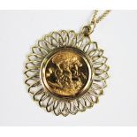 A sovereign set pendant, the sovereign dated 2000, within 9ct gold surround and attached fine chain,