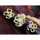 A 1970's diamond set ring and matching earrings,