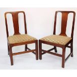 A pair of George III oak chairs, with solid splats and upholstered drop in seats,