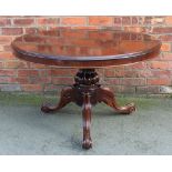 An early Victorian mahogany circular breakfast table, with gadrooned baluster column,
