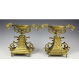 A pair of early 20th century gilt brass mantle garnitures,