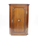 A George III inlaid oak hanging corner cabinet,