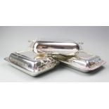 Three assorted entree dishes and covers, each of rectangular form with rounded and canted edges,