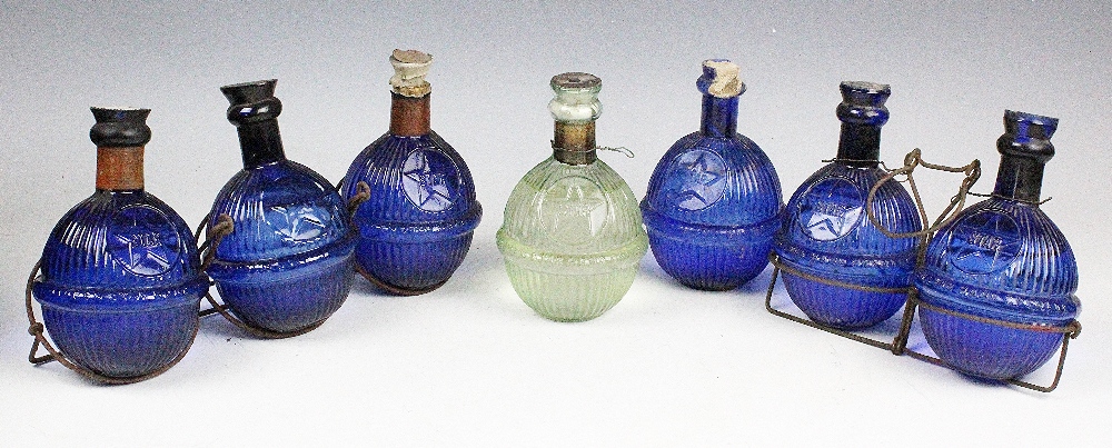 Six 19th century Harden Star blue glass fire extinguishers, and one clear glass example,