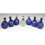 Six 19th century Harden Star blue glass fire extinguishers, and one clear glass example,