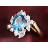 A blue zircon and diamond set ring,