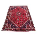 A Caucasian hand woven wool carpet,