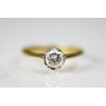 A diamond solitaire ring, the round brilliant cut diamond within white metal setting,