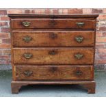 An 18th century and later oak and walnut cross banded chest, of four graduated long drawers,