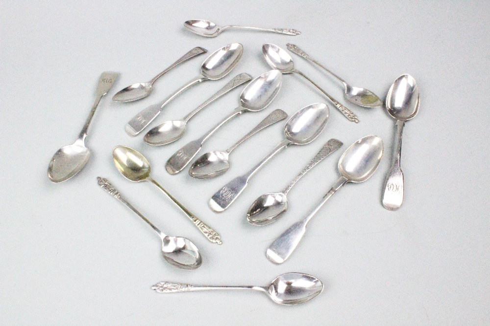 A collection of assorted silver spoons,