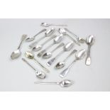 A collection of assorted silver spoons,