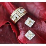 A coloured diamond set dress ring and a matched pair of stud earrings,