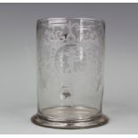 A late 18th century Silesian glass tankard, engraved with a stylised cartouche and flowers,