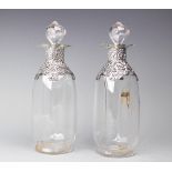 A pair of Victorian silver mounted decanters and stoppers, London 1896, each of square form,