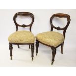 A set of six early Victorian mahogany dining chairs, with carved balloon type backs,