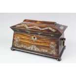 A 19th century mother of pearl inlaid Coromandel wood tea caddy, of sarcophagus form,