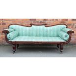 A William IV walnut scroll end settee, on turned legs,