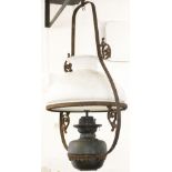 An early 20th century hanging oil lanterns frame with scroll and Greek key detailing,