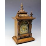 A German walnut and stained beech eight day mantel clock,
