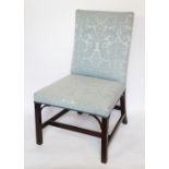 A George III and later Gainsborough type chair, with floral blue upholstery,
