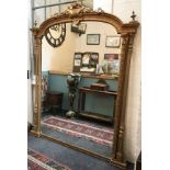 A large Victorian gilt wood and gesso over mantle mirror,