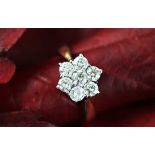 A seven stone diamond cluster ring,