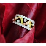 A Simon G diamond set tri-colour gold band,