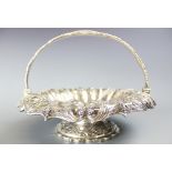 A William IV silver swing handled circular pedestal basket, 'HB' London 1830,