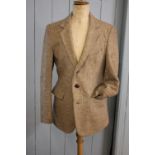 A gentleman's oatmeal wool tweed hunting jacket,