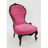 A Victorian carved walnut salon chair, with red upholstery, on cabriole legs,