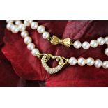 A Mikimoto diamond and pearl necklace,