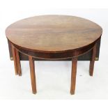 A George III mahogany D shaped dining table, with two D-ends and a hinged centre leaf,
