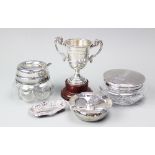 A selection of silver comprising; an Art Deco silver topped powder jar and cover,
