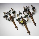 Three Louis XV style gilt metal twin branch wall lights, decorated with metal and ceramic flowers,