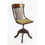 An Edwardian beech and ash swivel desk chair 95cm H