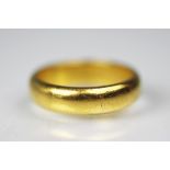 A 22ct yellow gold wedding band, size L/M, weight 7.
