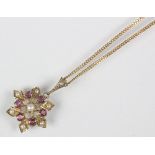 A 9ct yellow gold pendant set with pearls and rubies,