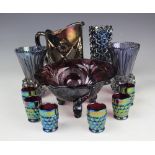 A selection of blue and purple carnival glass wares including,