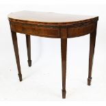 A George III mahogany and rosewood cross banded card table, on tapered square legs,
