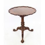 A George III style mahogany tilt top occasional table, with pie crust edge,