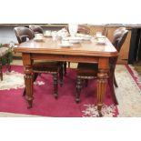 An early Victorian mahogany extending dining table, the top with a moulded edge,