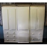 A Victorian cream painted pine housekeepers cabinet, of sectional form,