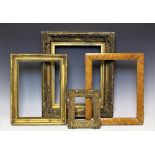 A collection of early 19th century and later picture frames including two birds eye maple examples,