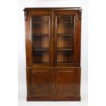 An Edwardian stained pine bookcase cabinet,