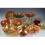 A selection of large marigold carnival glass bowls and centre dishes including,
