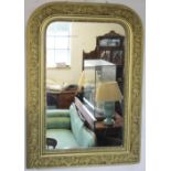 A 19th century French gilt wood and gesso wall mirror, with curved top and floral border,