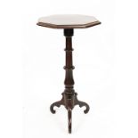 A 19th century walnut candle stand, with octagonal top on tripod base,