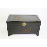 A Chinese carved camphor wood blanket box,