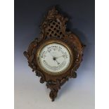 A Victorian carved oak barometer retailed by 'A.